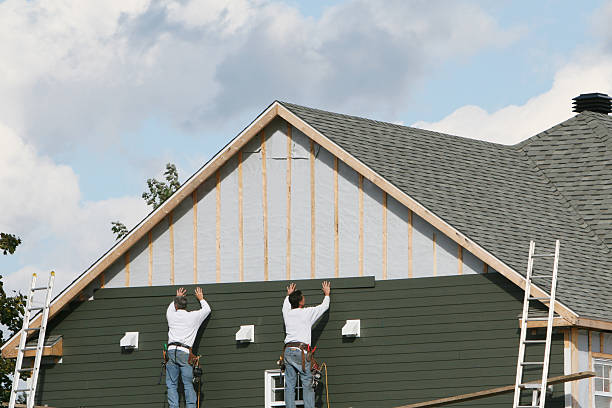 Professional Storm Damage Siding Repair technician working in Karns City, PA